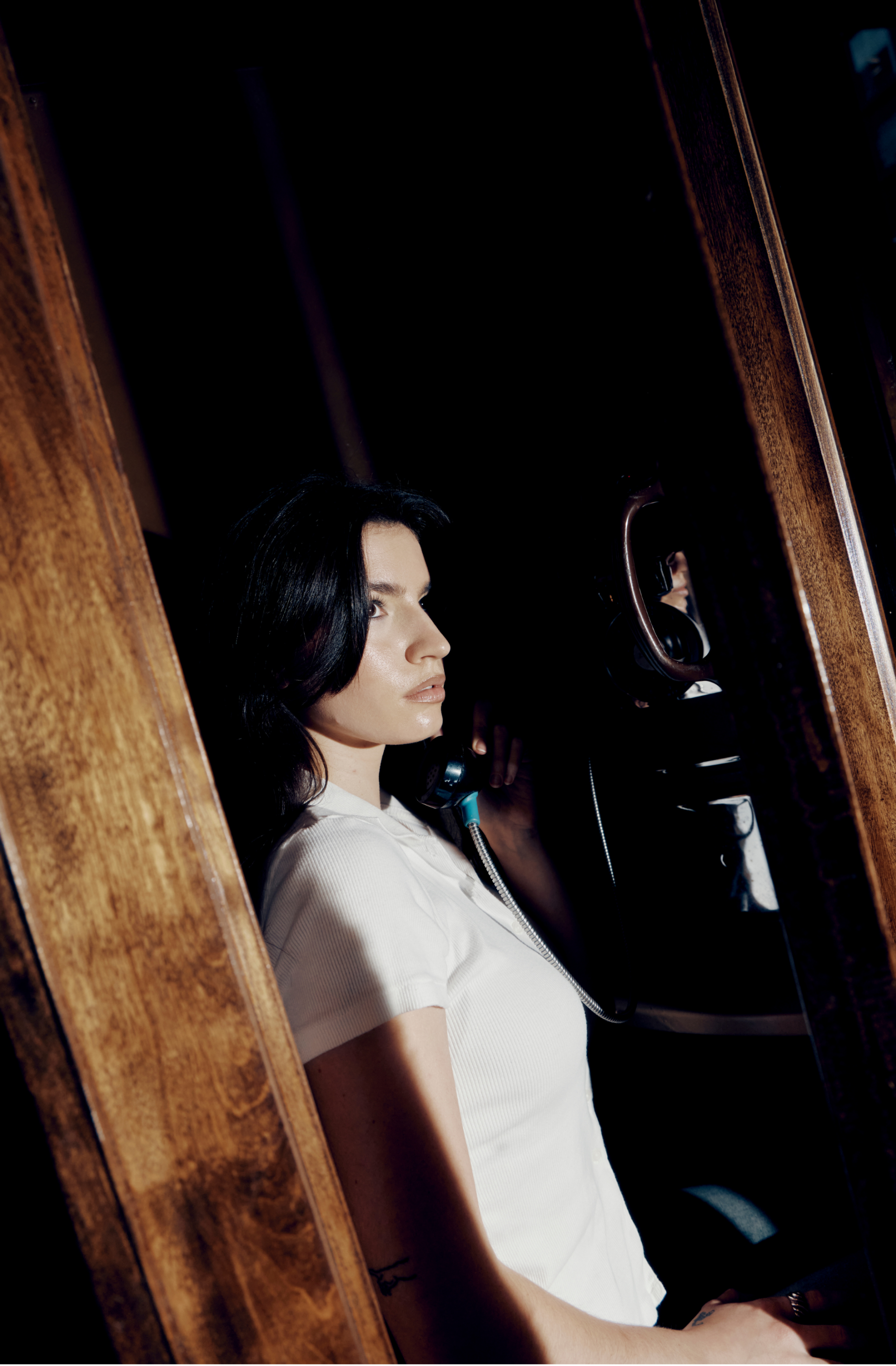 a woman holding a telephone