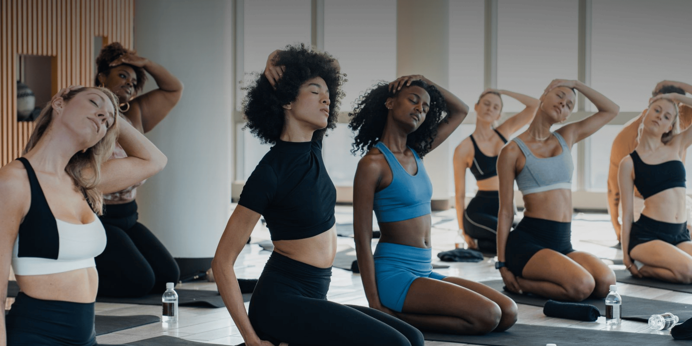 a group of women sitting on the floor