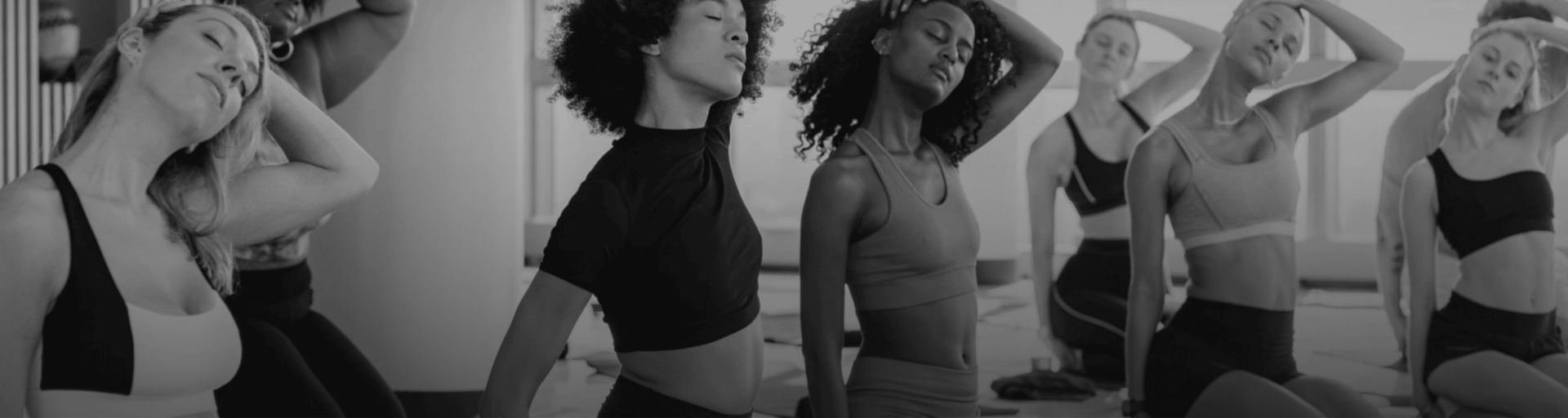 a woman with curly hair and a woman with her eyes closed