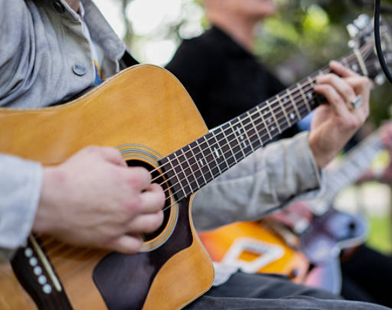 a person playing a guitar