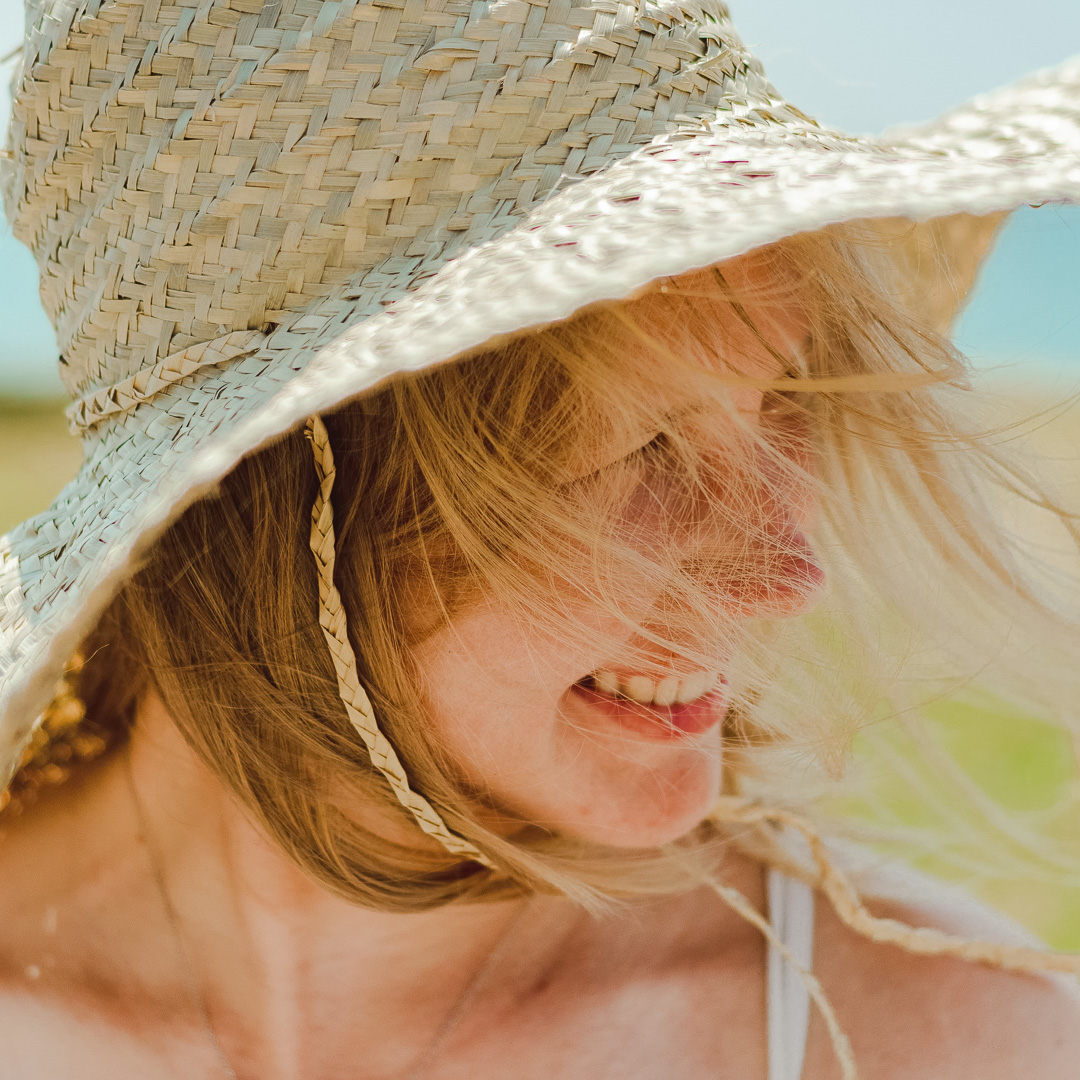 a woman wearing a straw hat