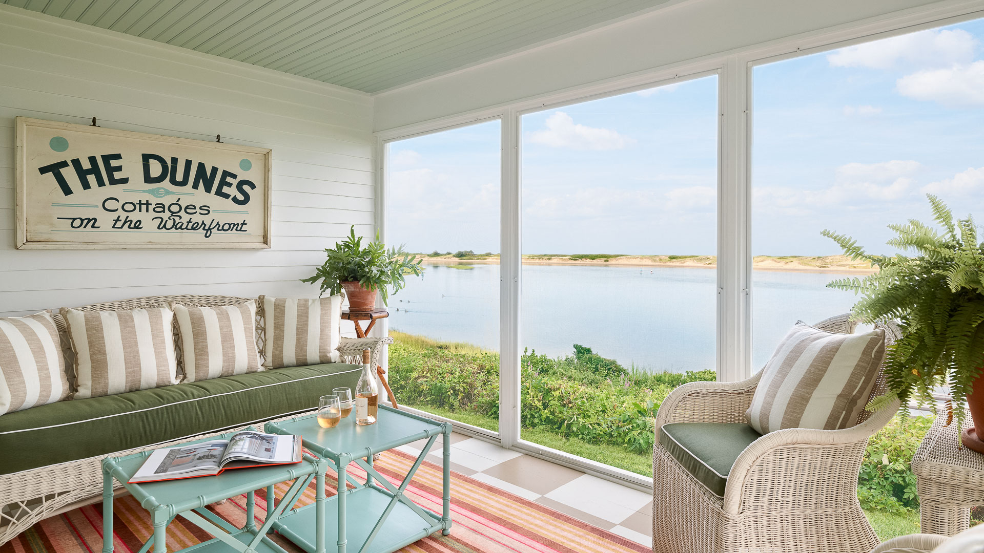 a room with a view of water and a couch