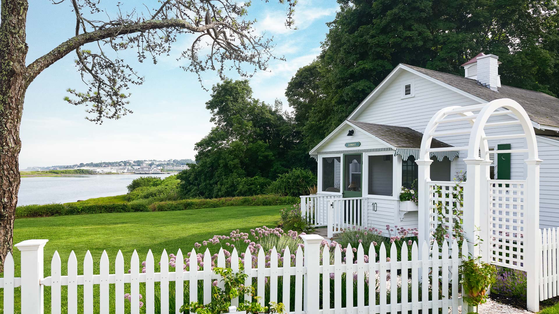 a white house with a white picket fence