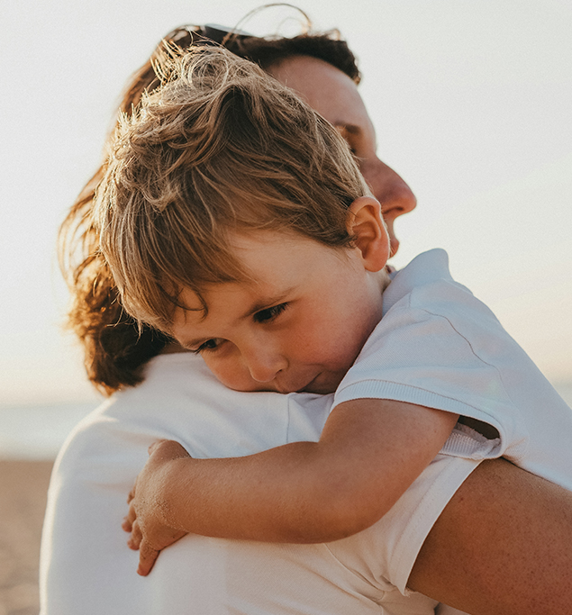 a child hugging a man
