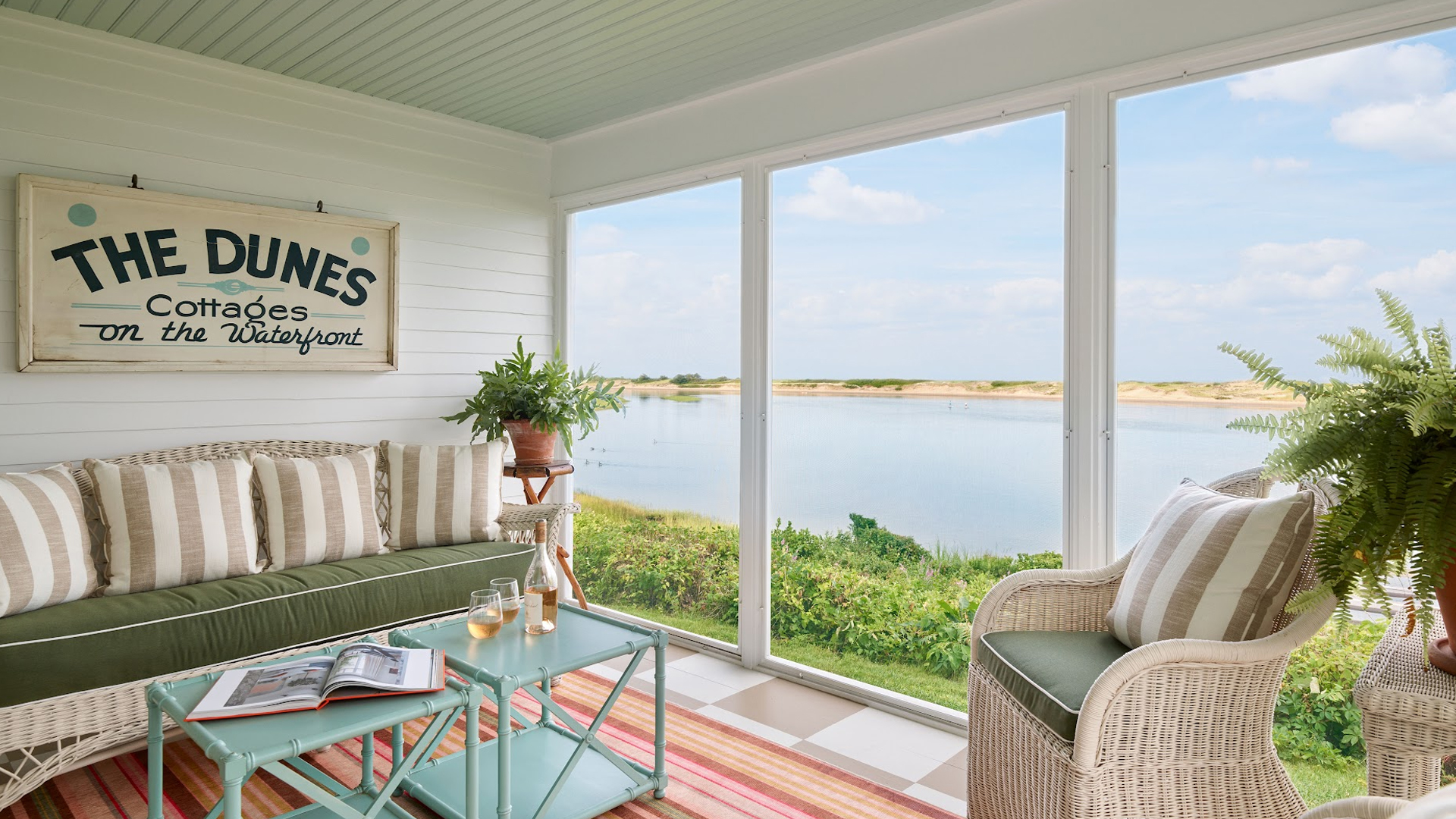 a room with a view of water and a couch