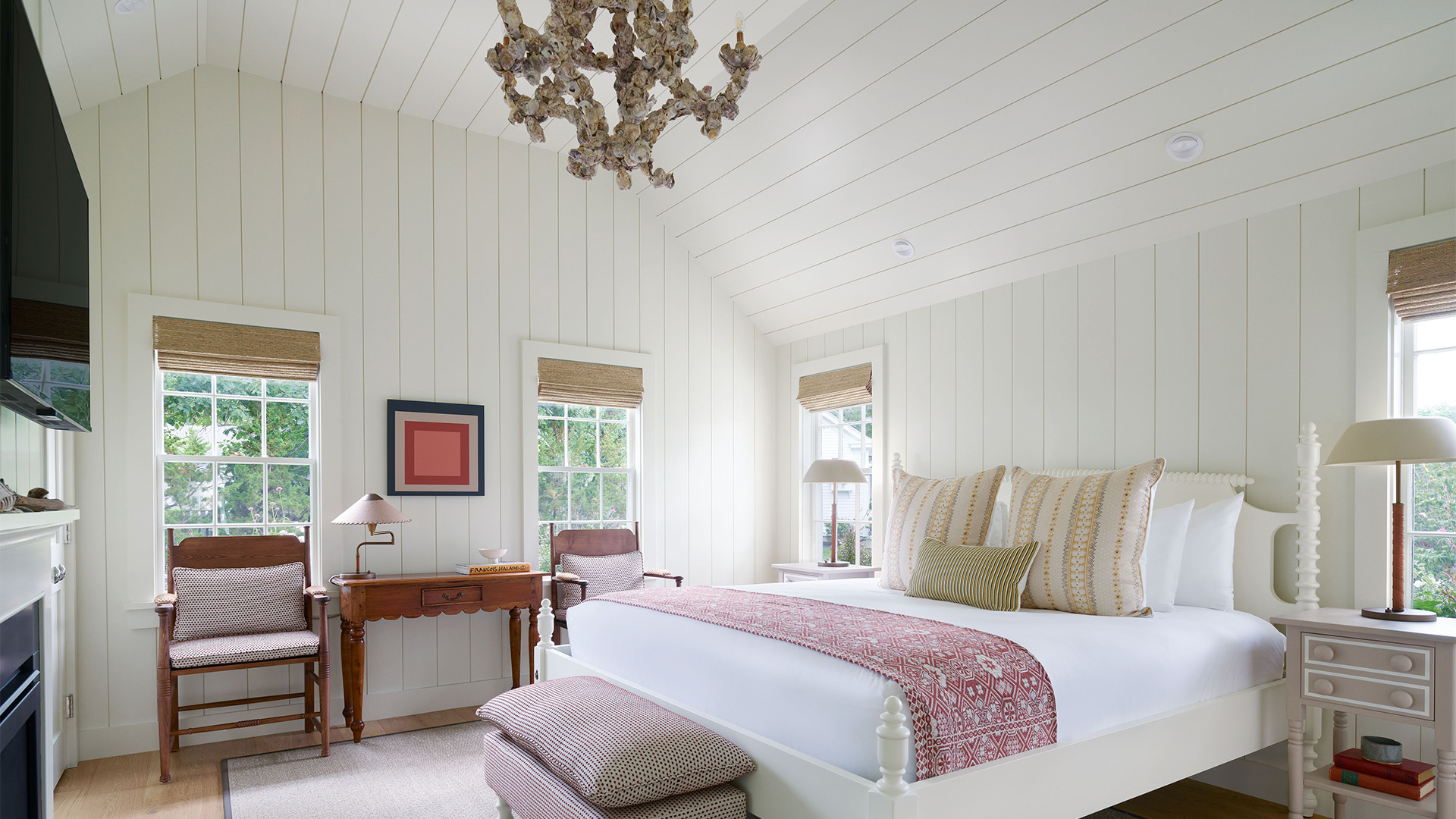 a bedroom with a bed and a desk