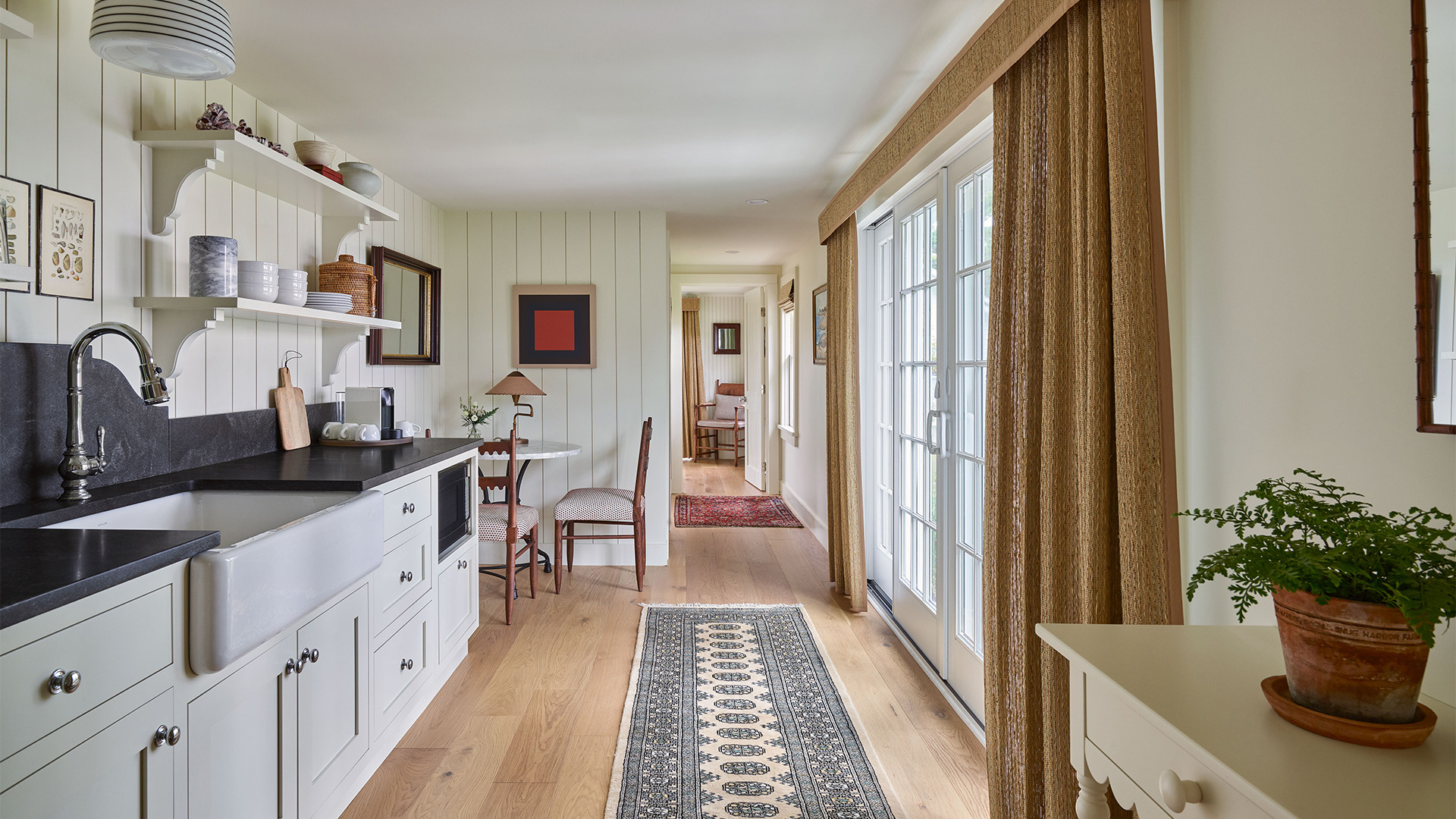 a room with a rug and a table