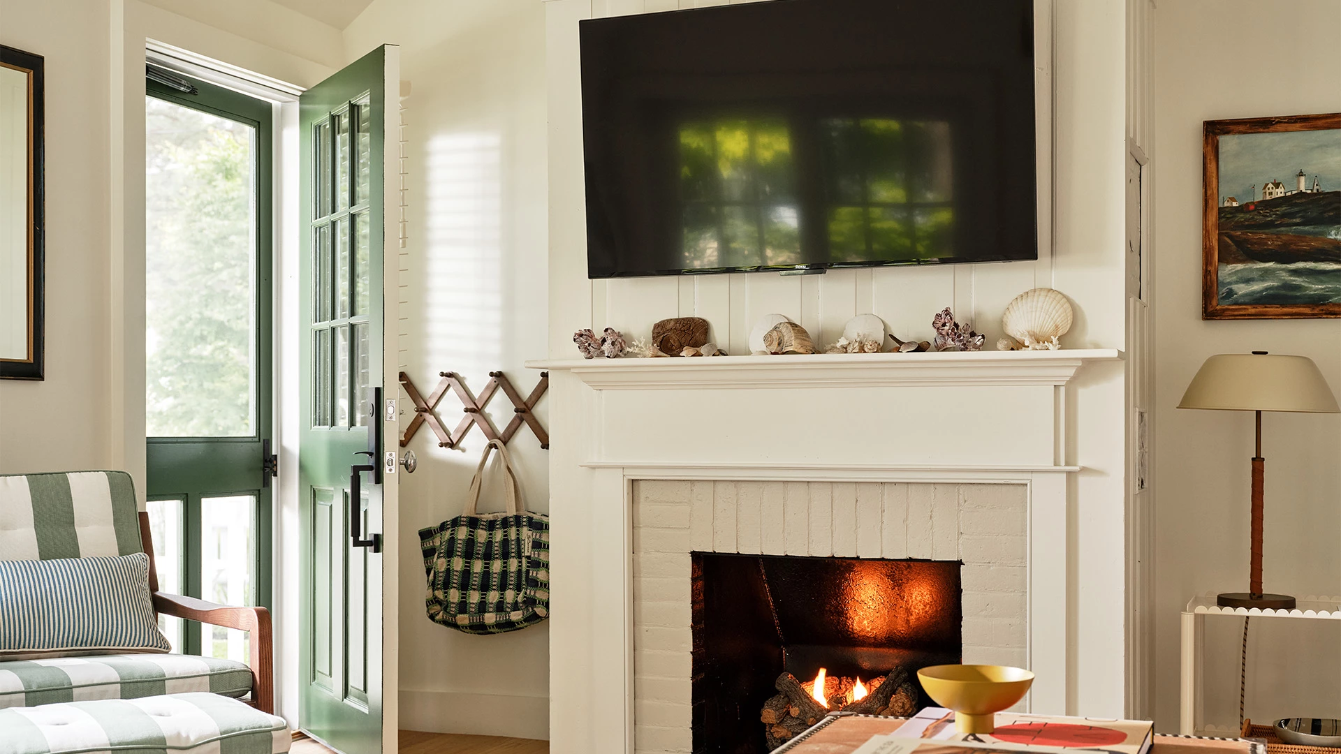 a fireplace with a television above it