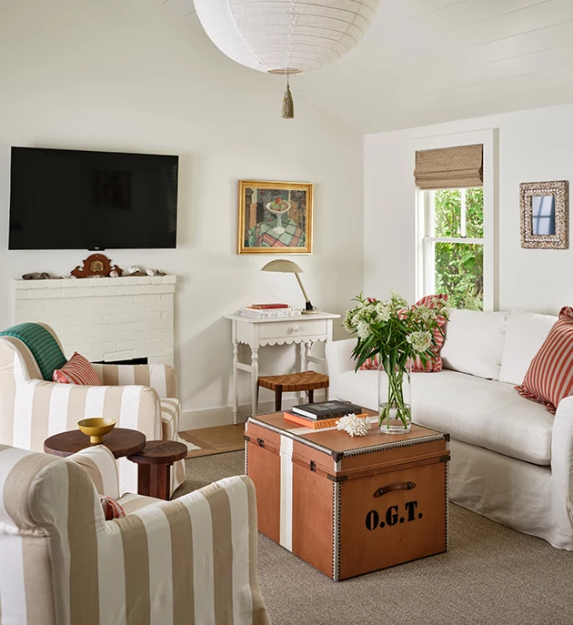 a living room with couches and a television