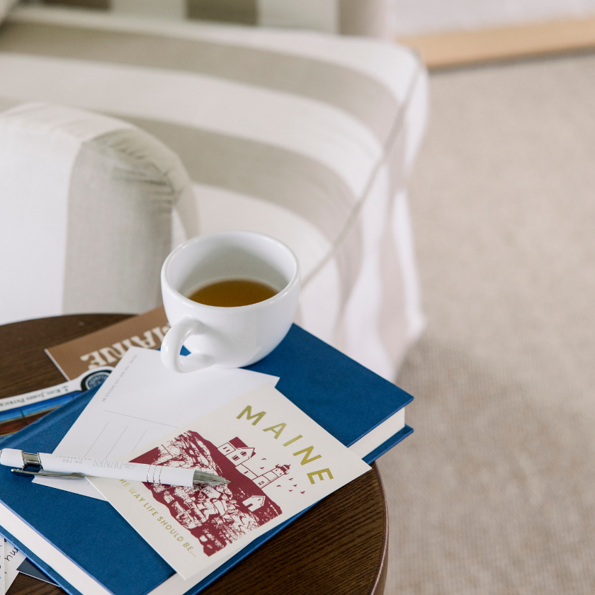 a cup of tea and books on a table