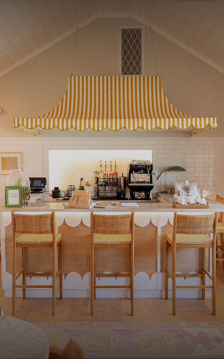 a coffee shop with chairs and a counter