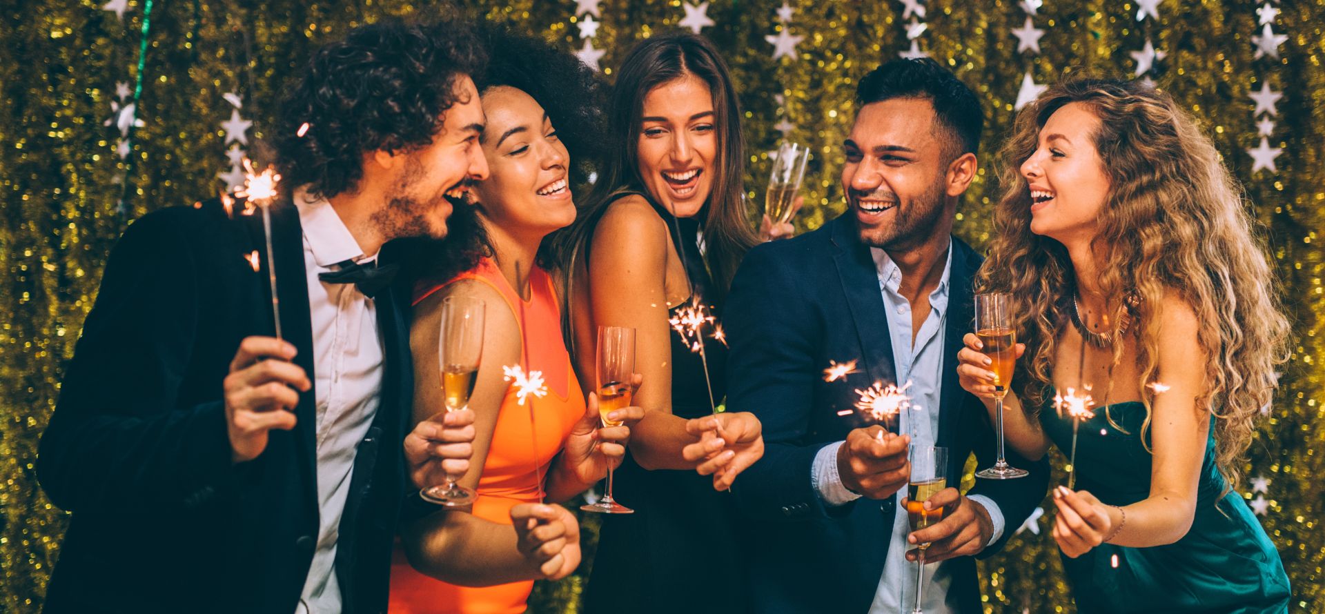 a group of people holding champagne glasses