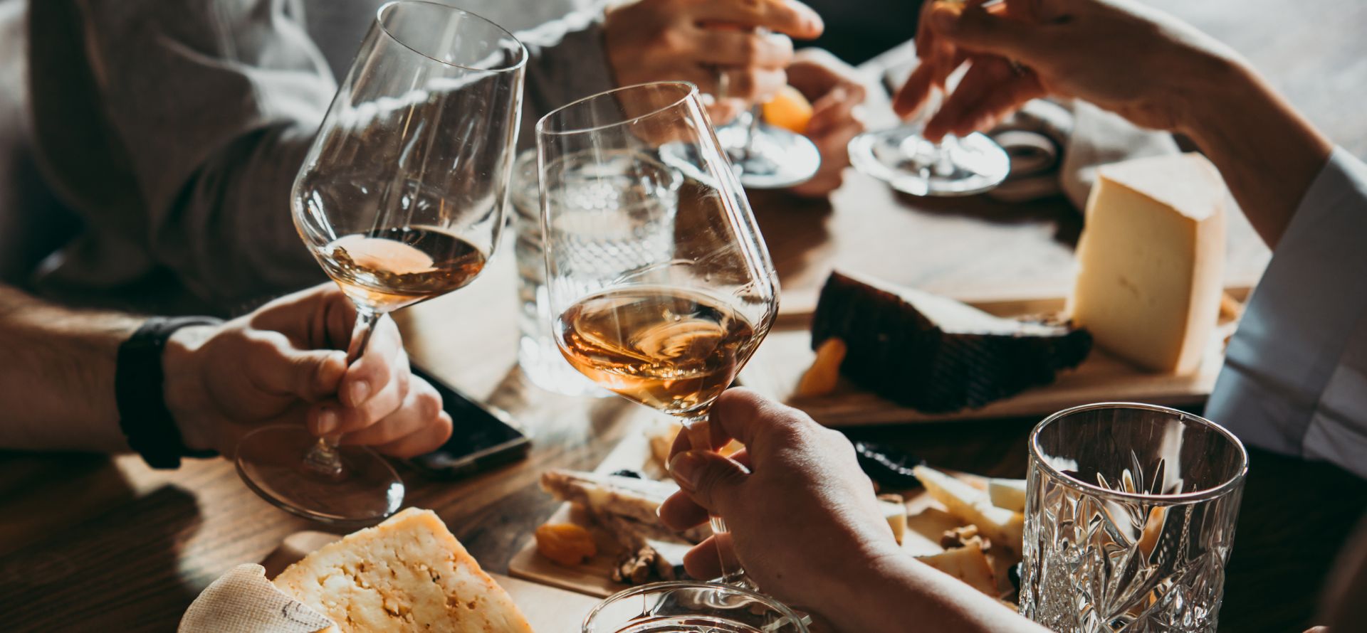 a group of people holding wine glasses