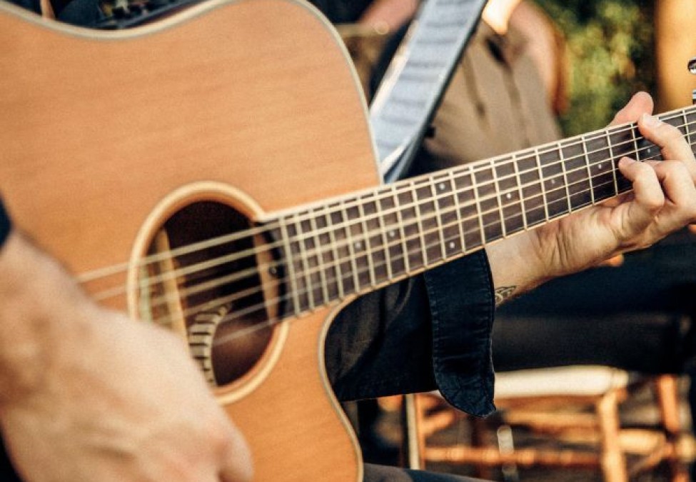 a person playing a guitar
