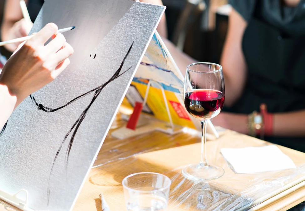 a person drawing on a canvas
