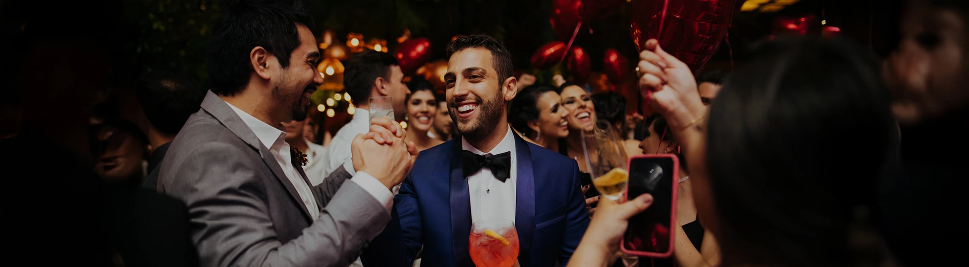 a group of people holding hands and smiling