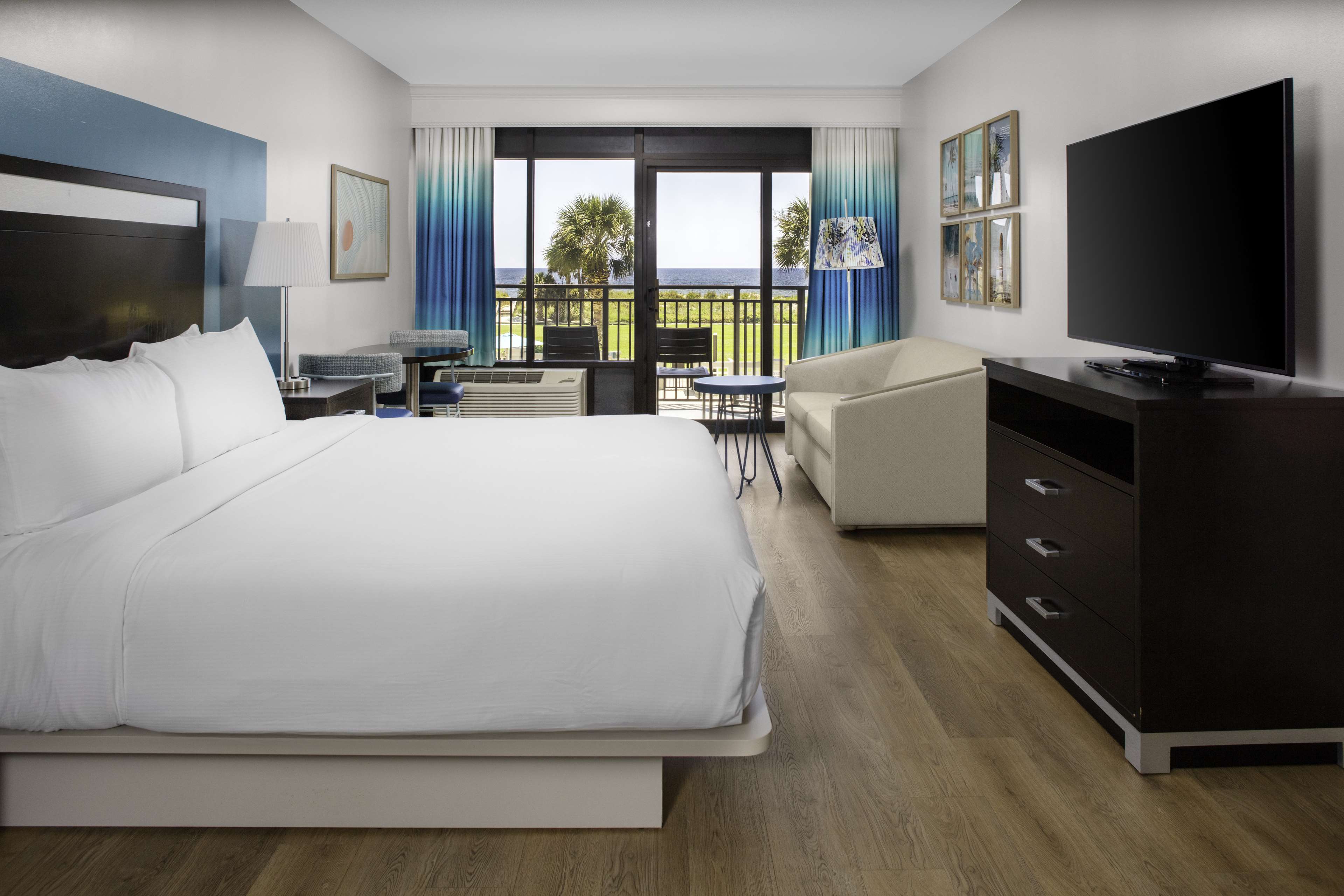 a room with a bed and a television