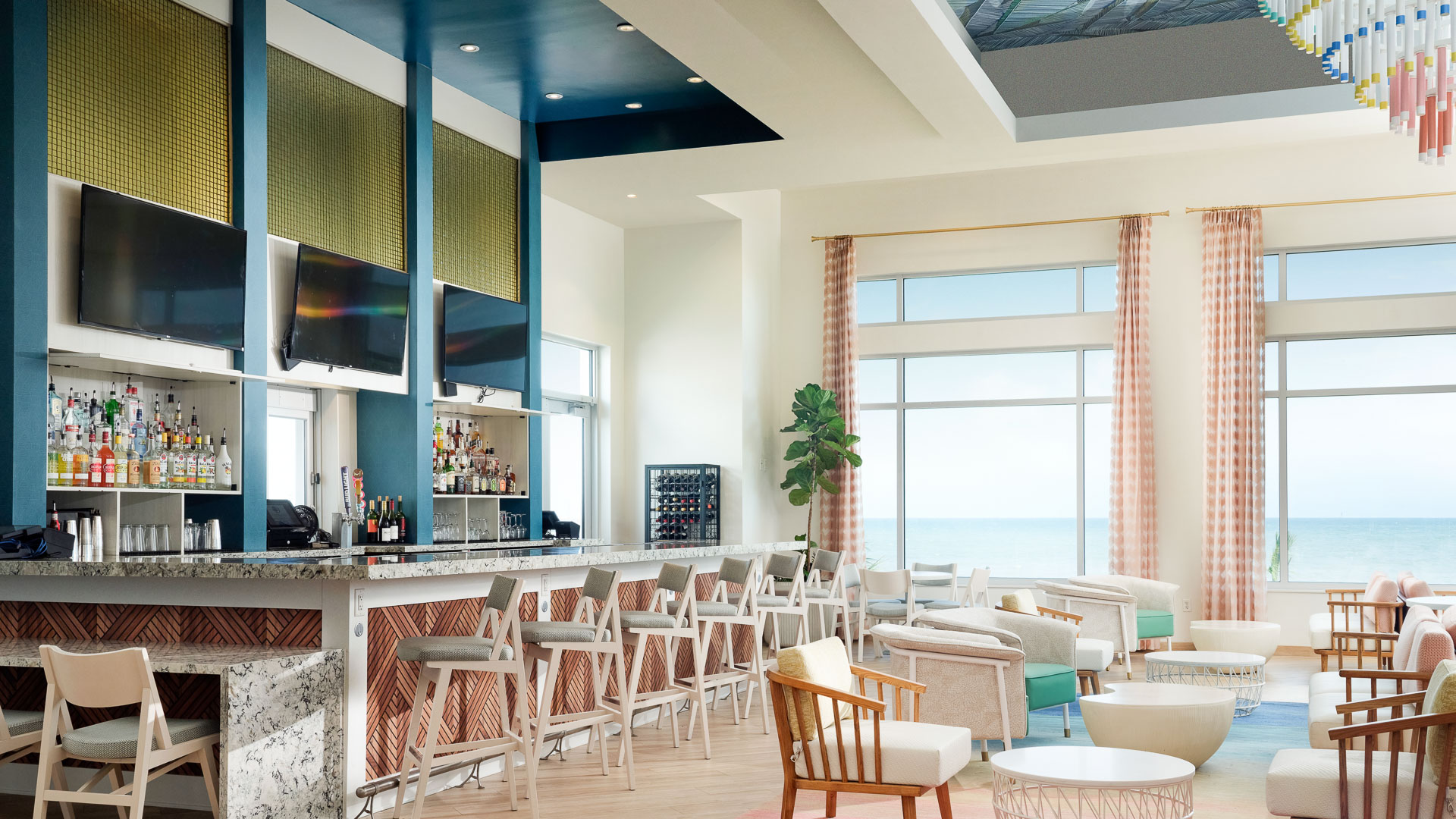 a room with a bar and chairs