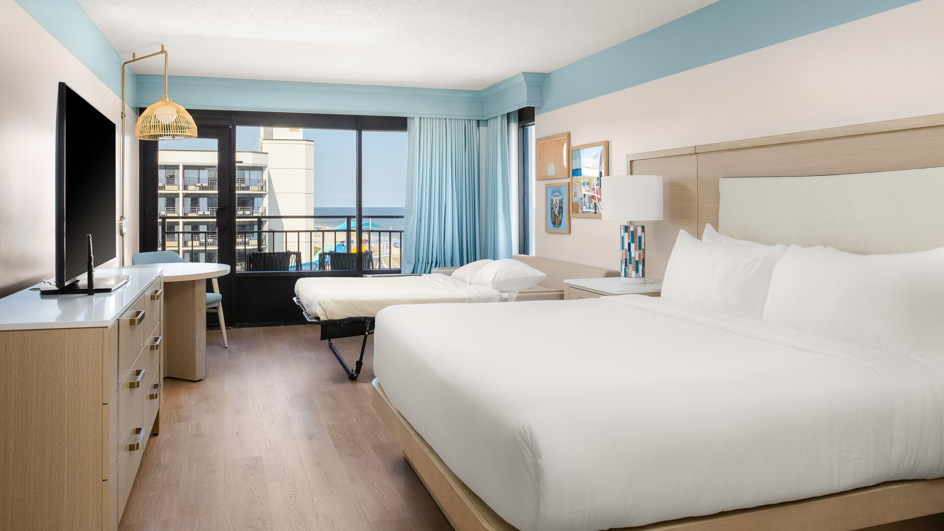 a room with two beds and a table