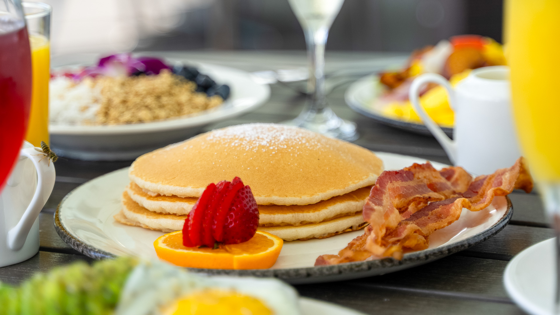 a plate of pancakes and bacon