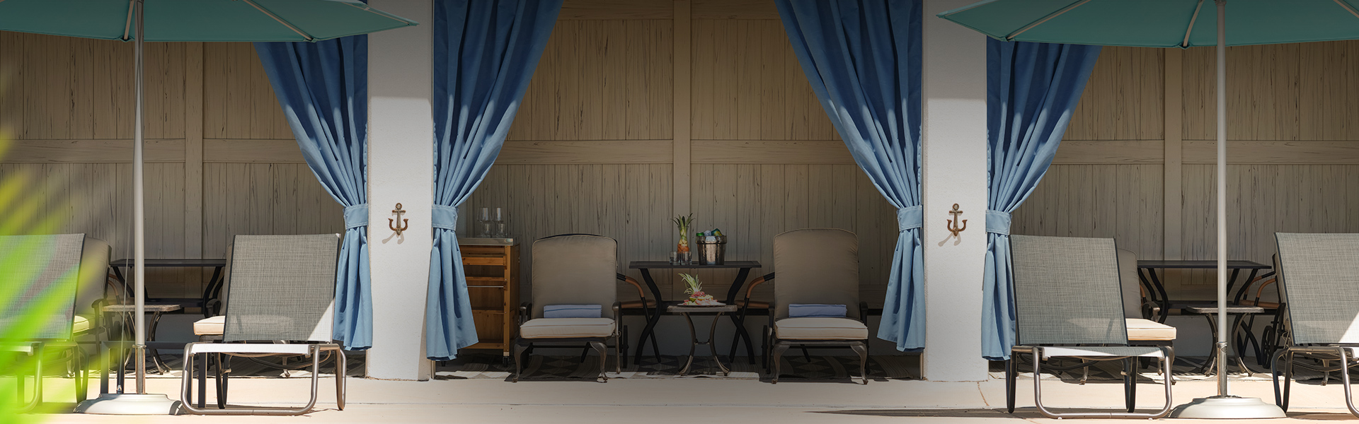 chairs and a table with blue curtains