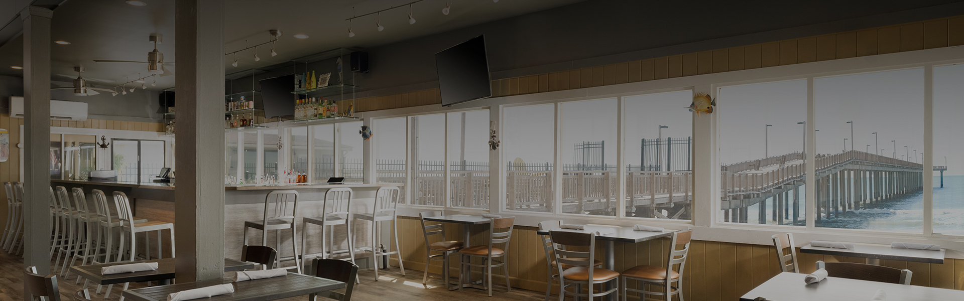 a room with a television and tables