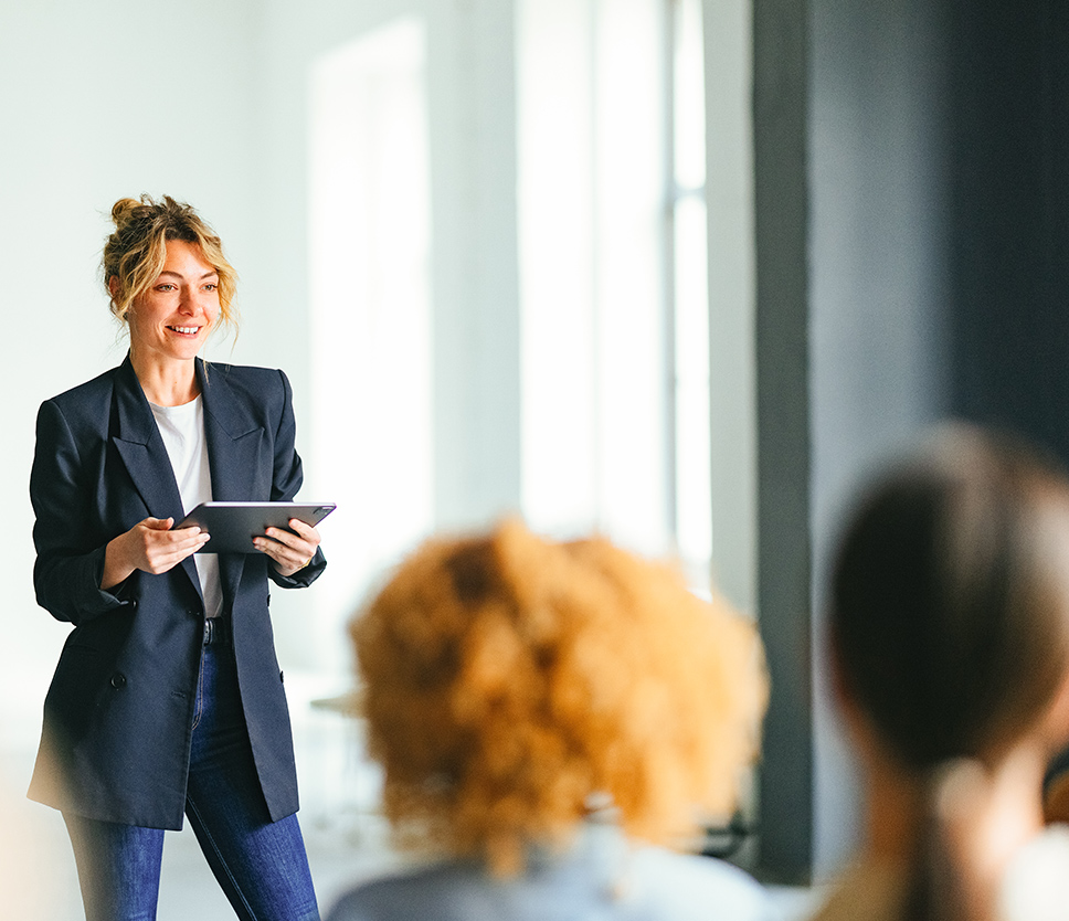 a woman holding a tablet