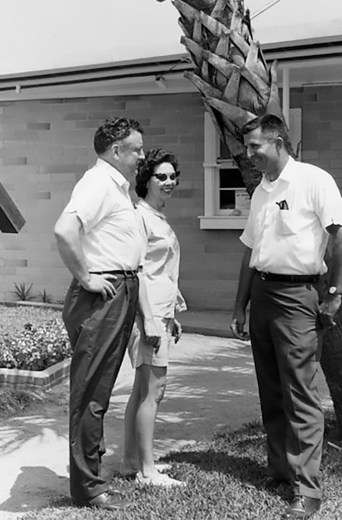 a group of people standing outside a building