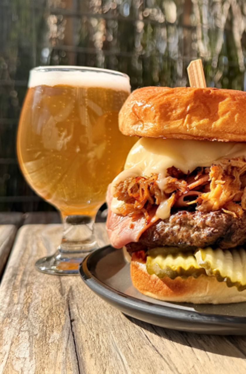 a burger and a glass of beer