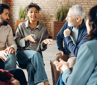 a group of people sitting in a circle