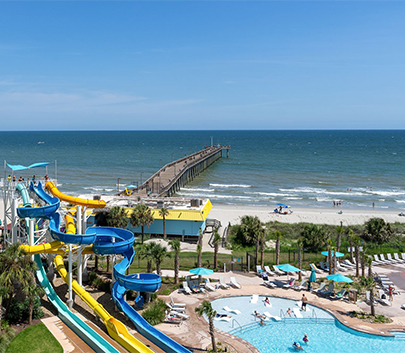 a water slide and a swimming pool at a resort