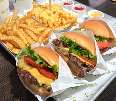 a tray of burgers and fries