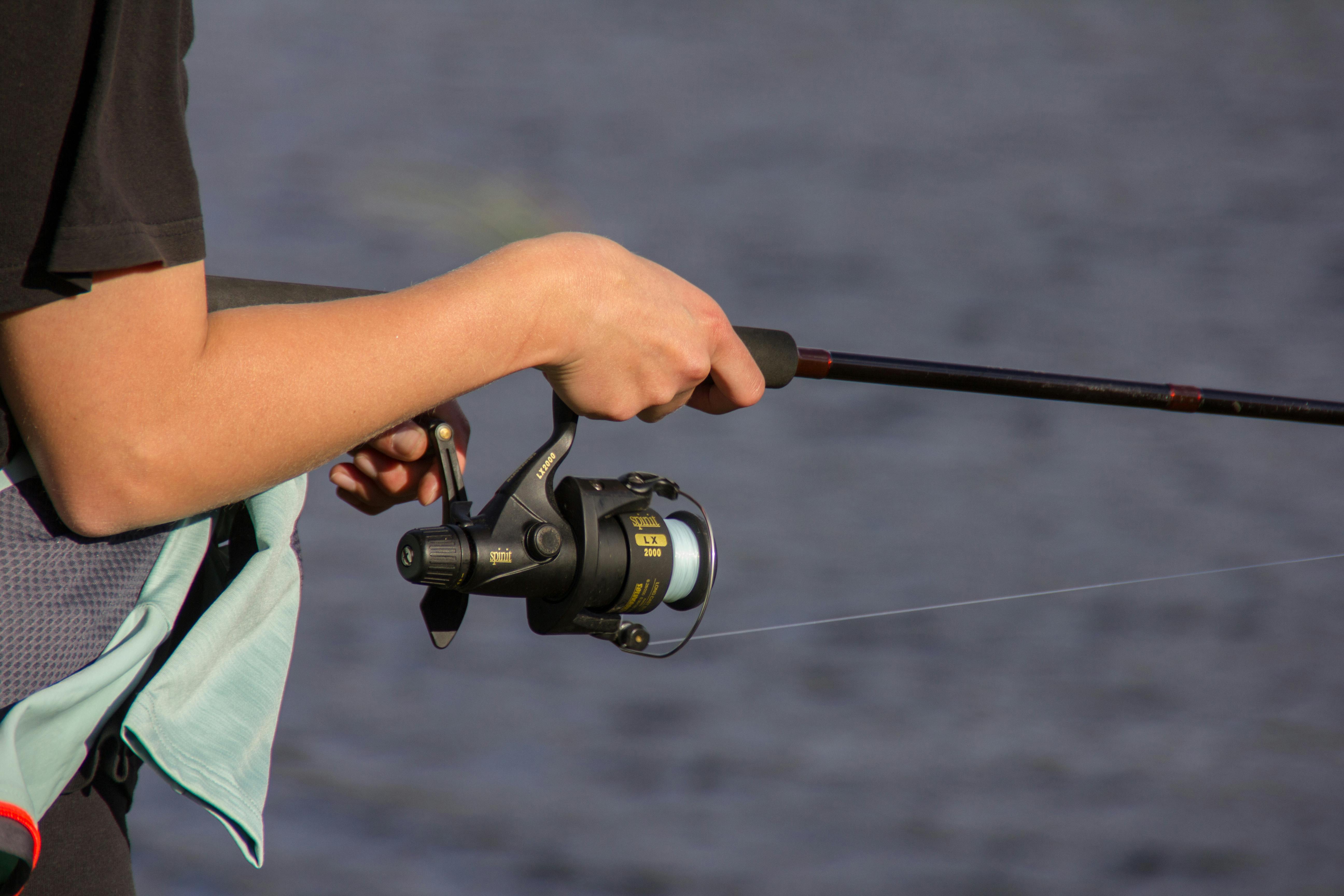 a person holding a fishing pole