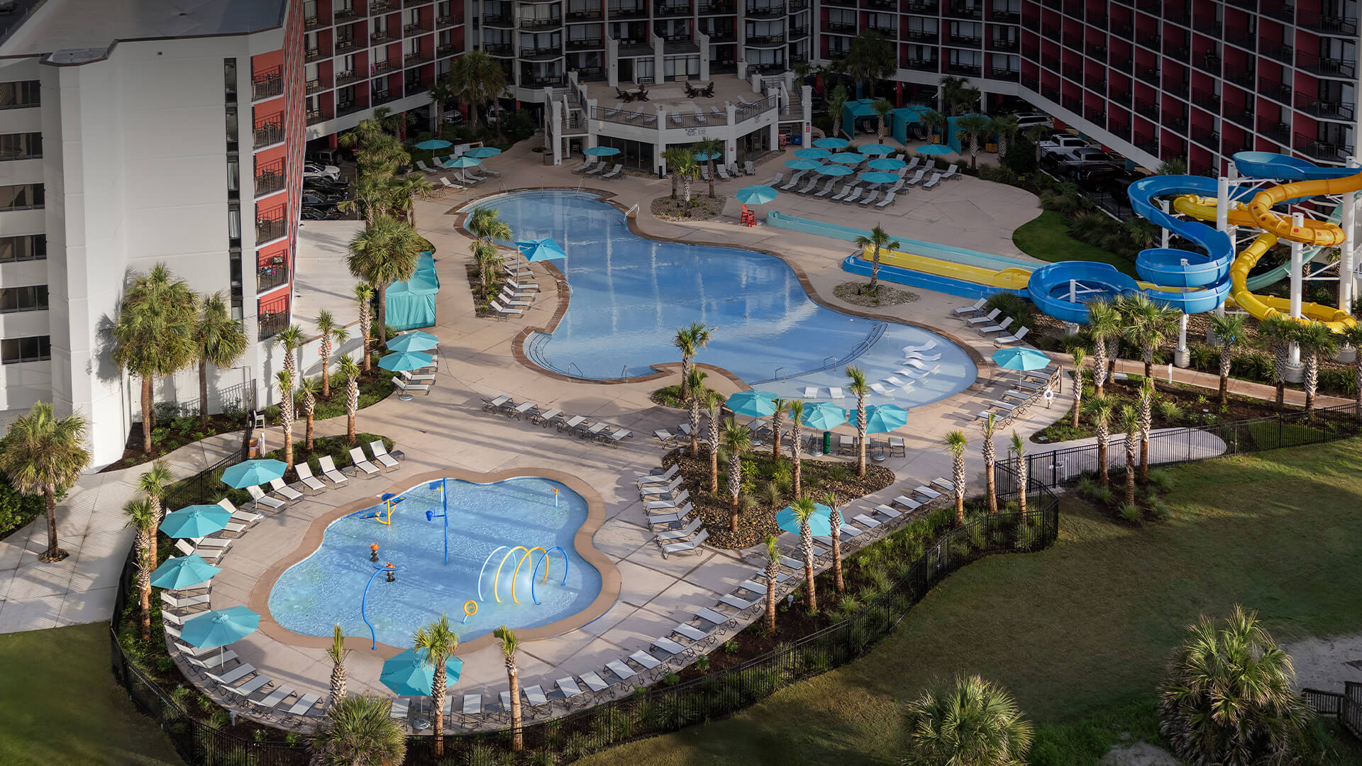 a swimming pool and a pool with palm trees