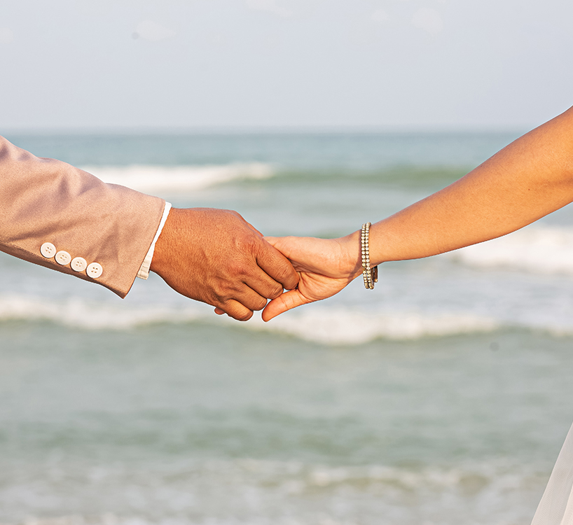 a man and woman holding hands