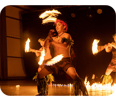 a group of men dancing with fire