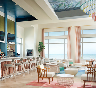 a room with a bar and chairs