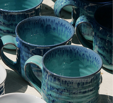 a group of blue mugs