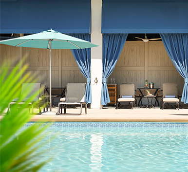 a pool with chairs and umbrellas