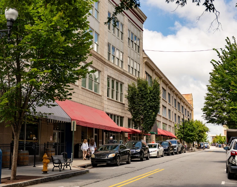a street with cars parked on the side of the road