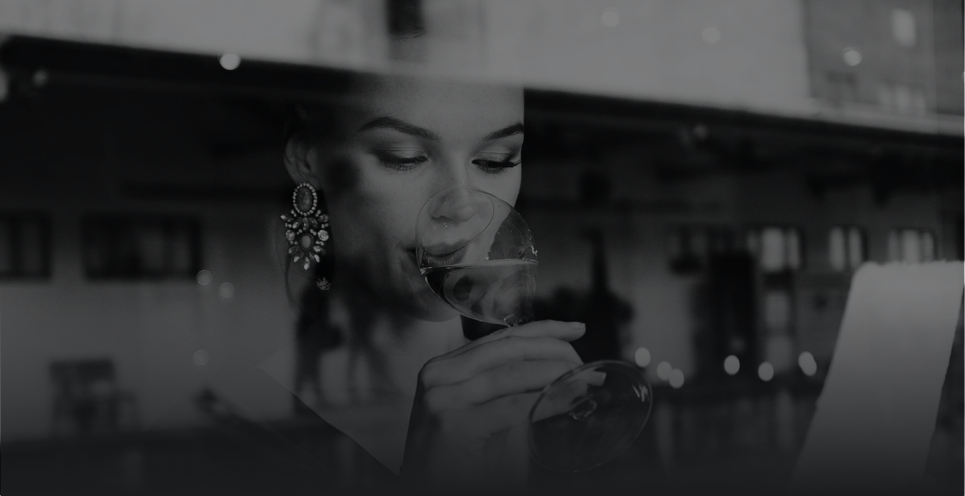 a woman drinking from a glass