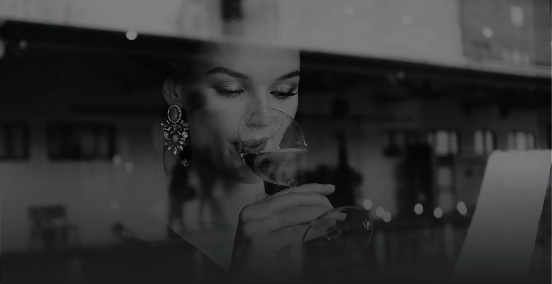 a woman drinking from a glass