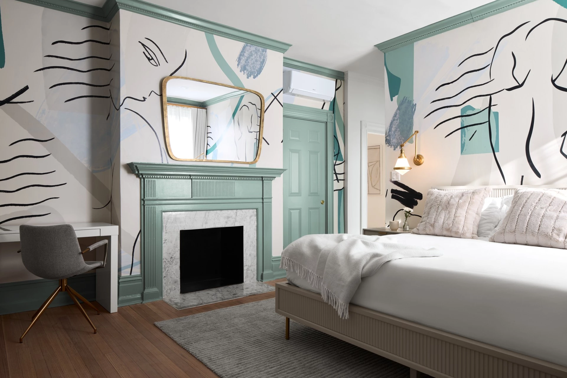 a room with a fireplace and a bed