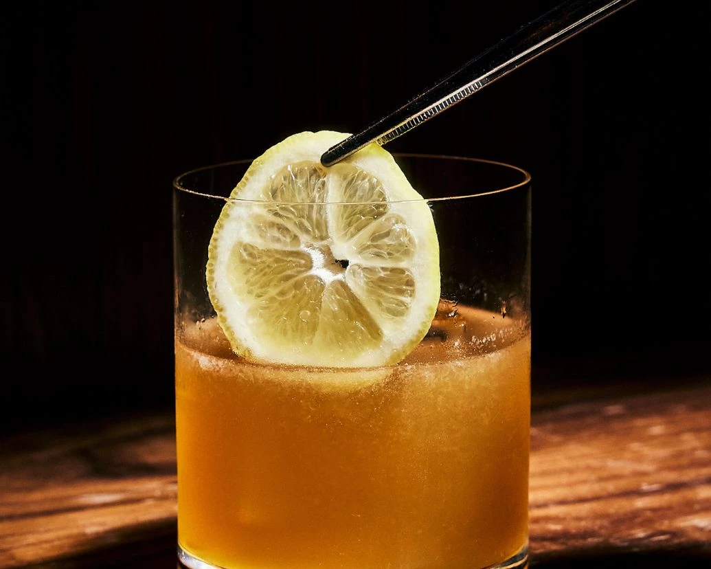 Post image for a lemon wedge in a glass of liquid