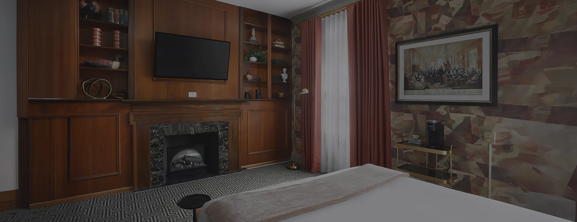 a room with a fireplace and a bed