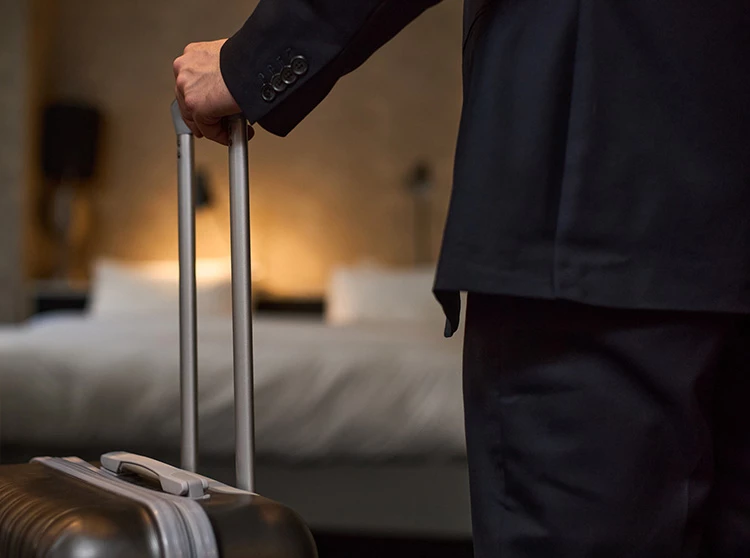 a person holding a suitcase
