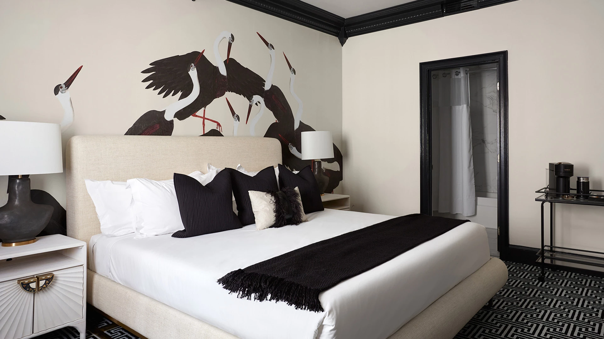 Post image for a bed with a black blanket and pillows