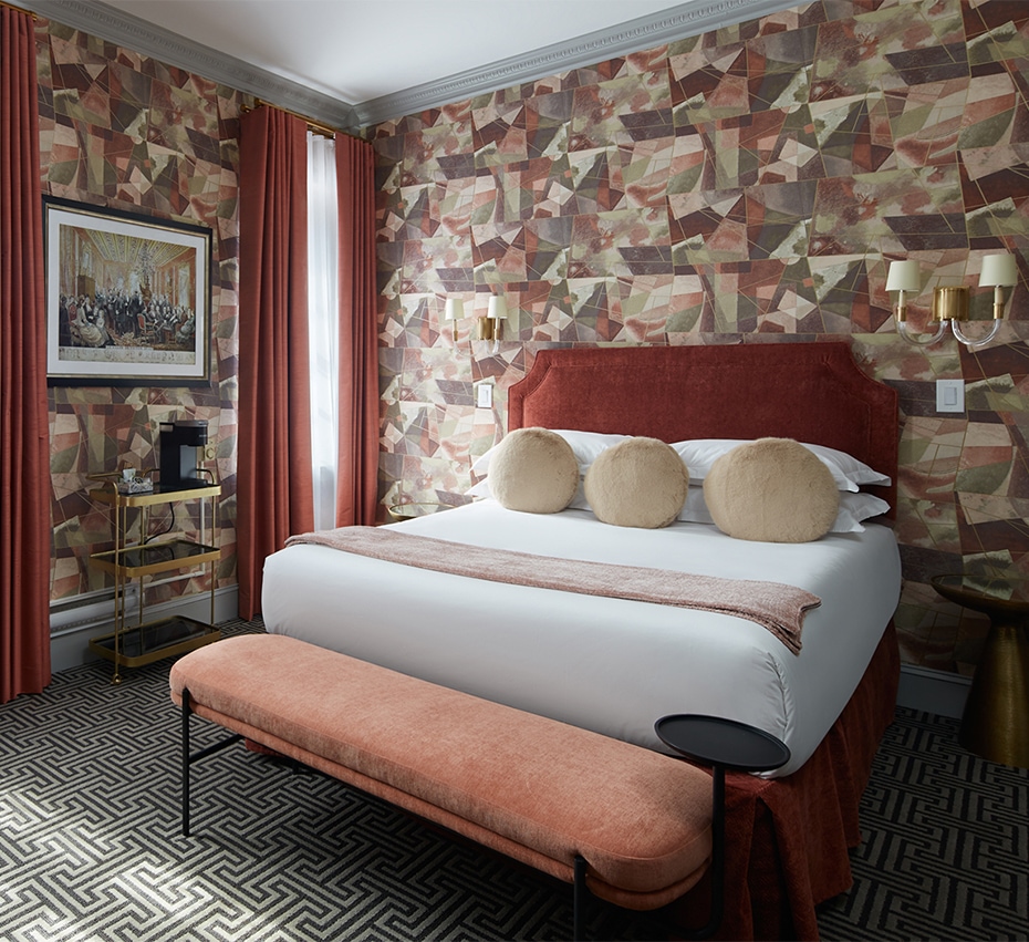 Post image for a bed with a bench in a room