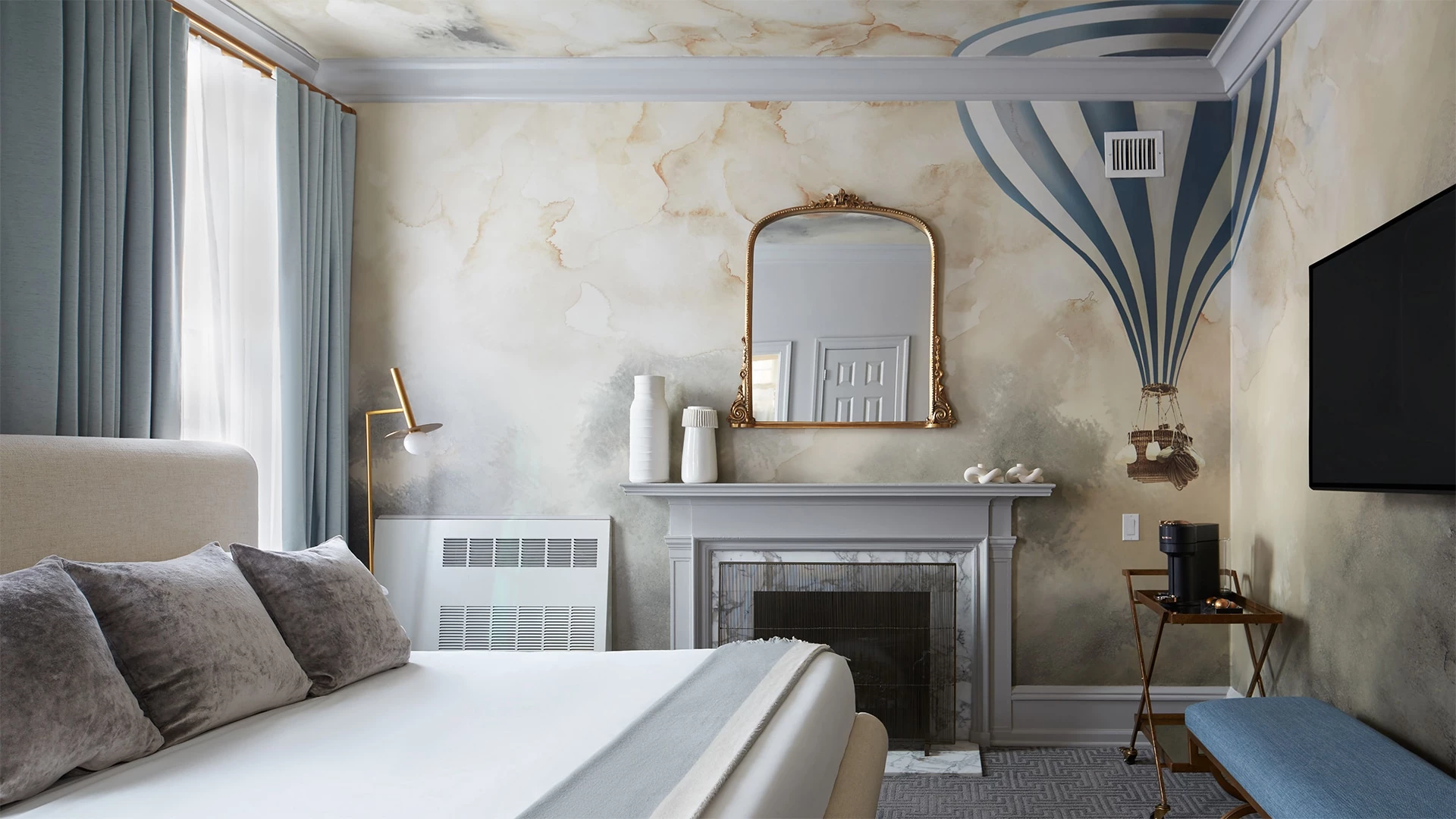 a room with a fireplace and a bed
