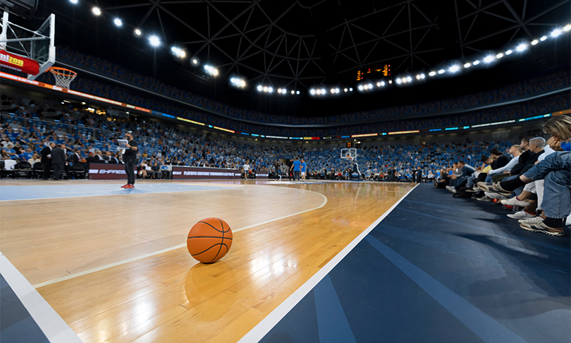 a basketball on the court in a stadium